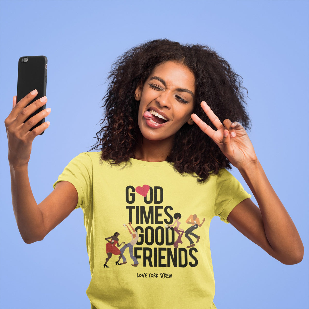 Woman taking a selfie in the yellow Good Times Good Friends tee by Love Cork Screw