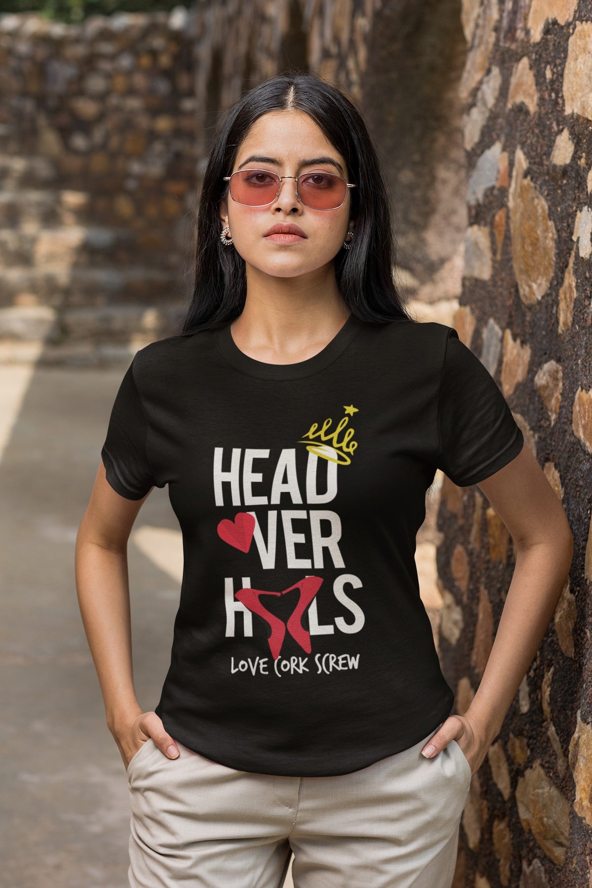Woman in sunglasses wearing the black Head Over Heels tee by Love Cork Screw