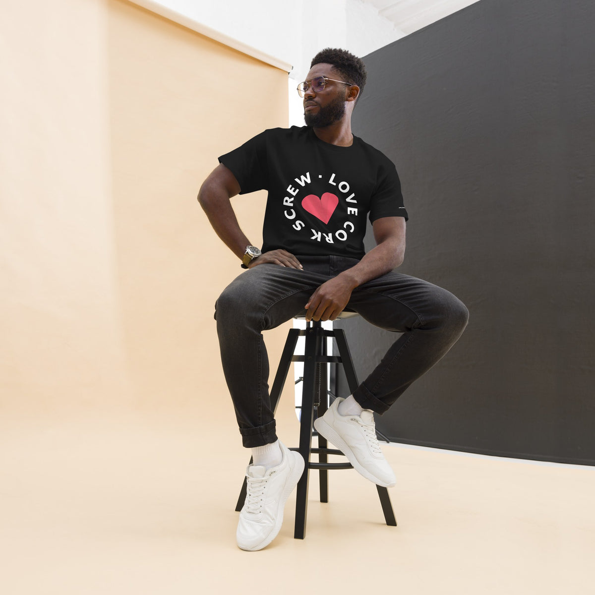 Man wearing the black Love Cork Screw heart logo tee
