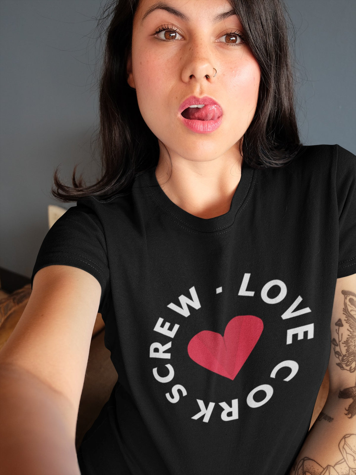 Woman taking a selfie in the black Love Cork Screw logo tee